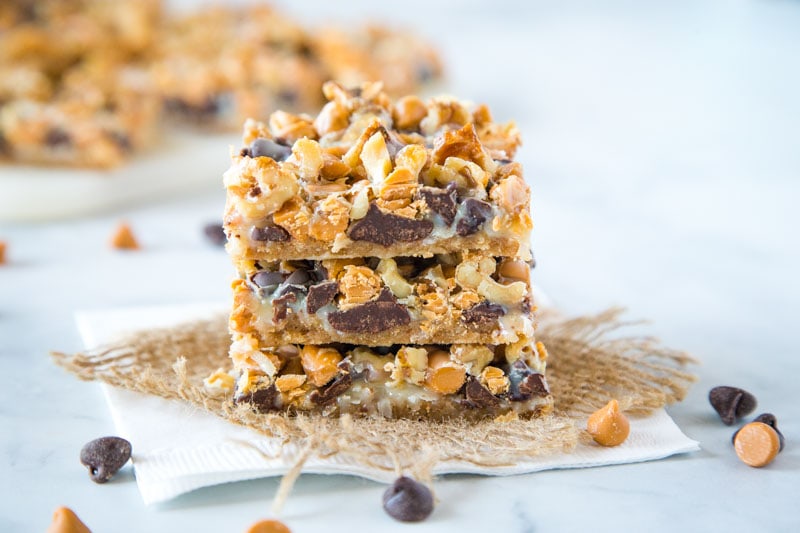 Magic Cookie Bars - These bars come together in one pan and are so easy to make.  Layers of graham crackers, chocolate, butterscotch, coconut, nuts and sweetened condensed milk.