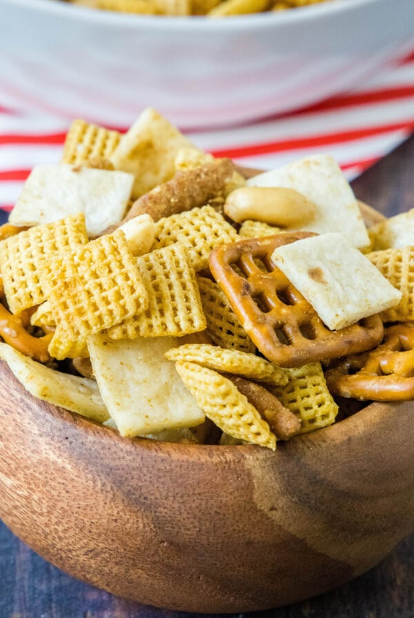 close up mexican snack mix in a wood bowl