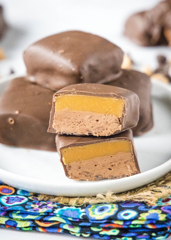 milky way candy cut in half on a white plate