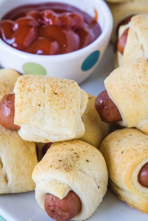 cropped close up mini pigs in a blanket on a plate