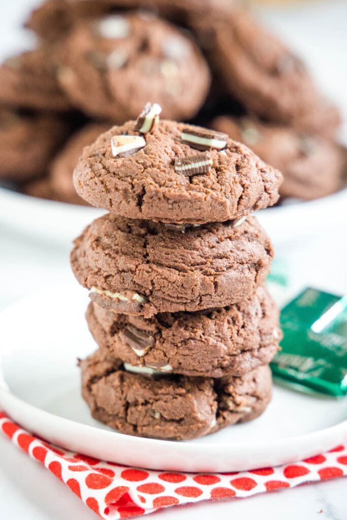 chocolate pudding cookies stacked on a white plate
