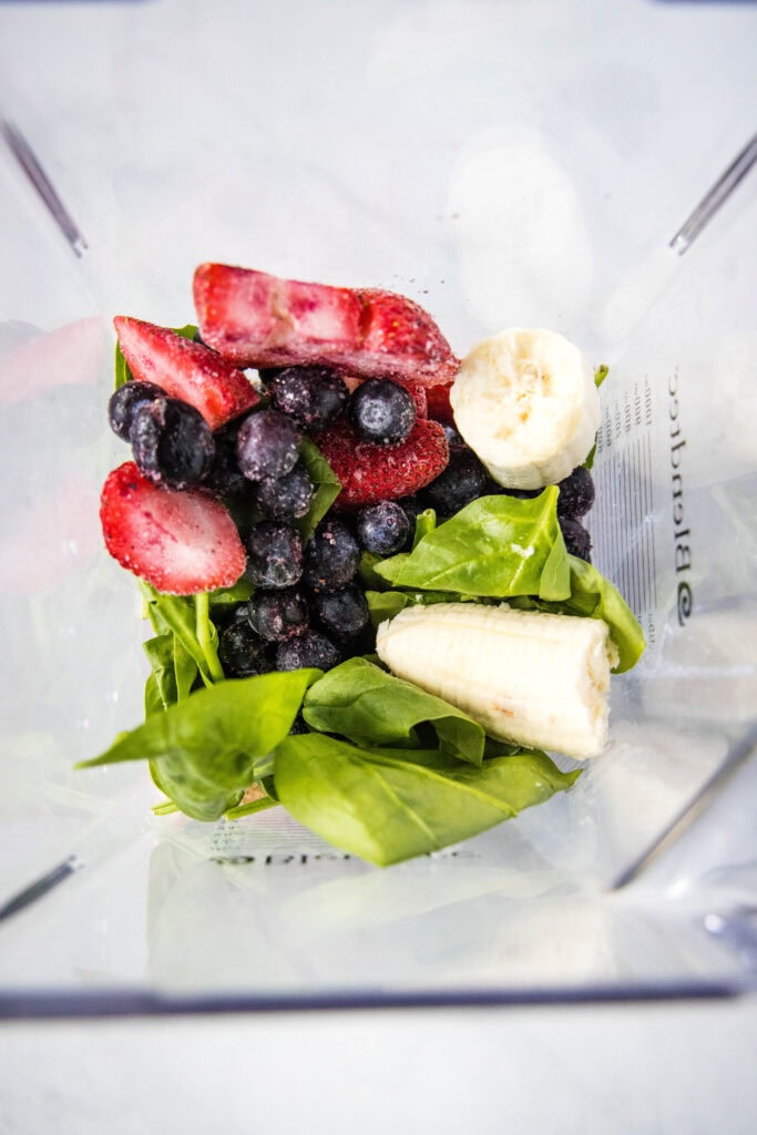 ingredients in blender for berry smoothie