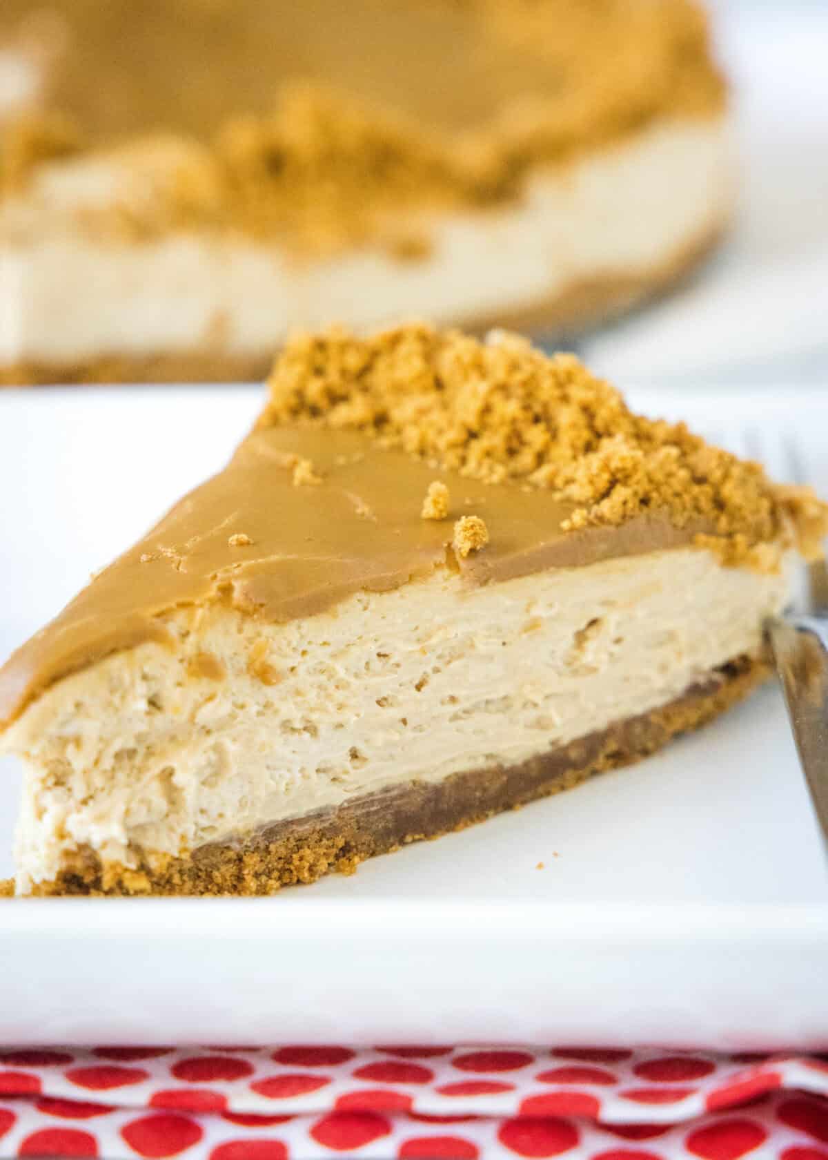 biscoff cheesecake slice on a white plate