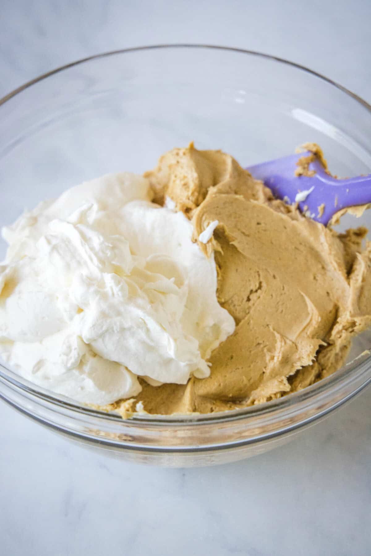 cream cheese mixture and whipped cream in a mixing bowl