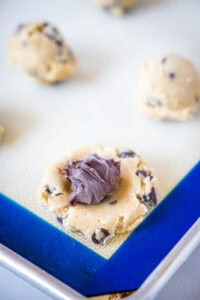 putting nutella balls inside cookie dough