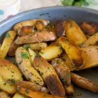 Pan Seared Mojo Potatoes - fingerling potatoes are seared and cooked to perfection in just minutes. Then mixed with a cilantro and herb mixture for a delicious side dish.