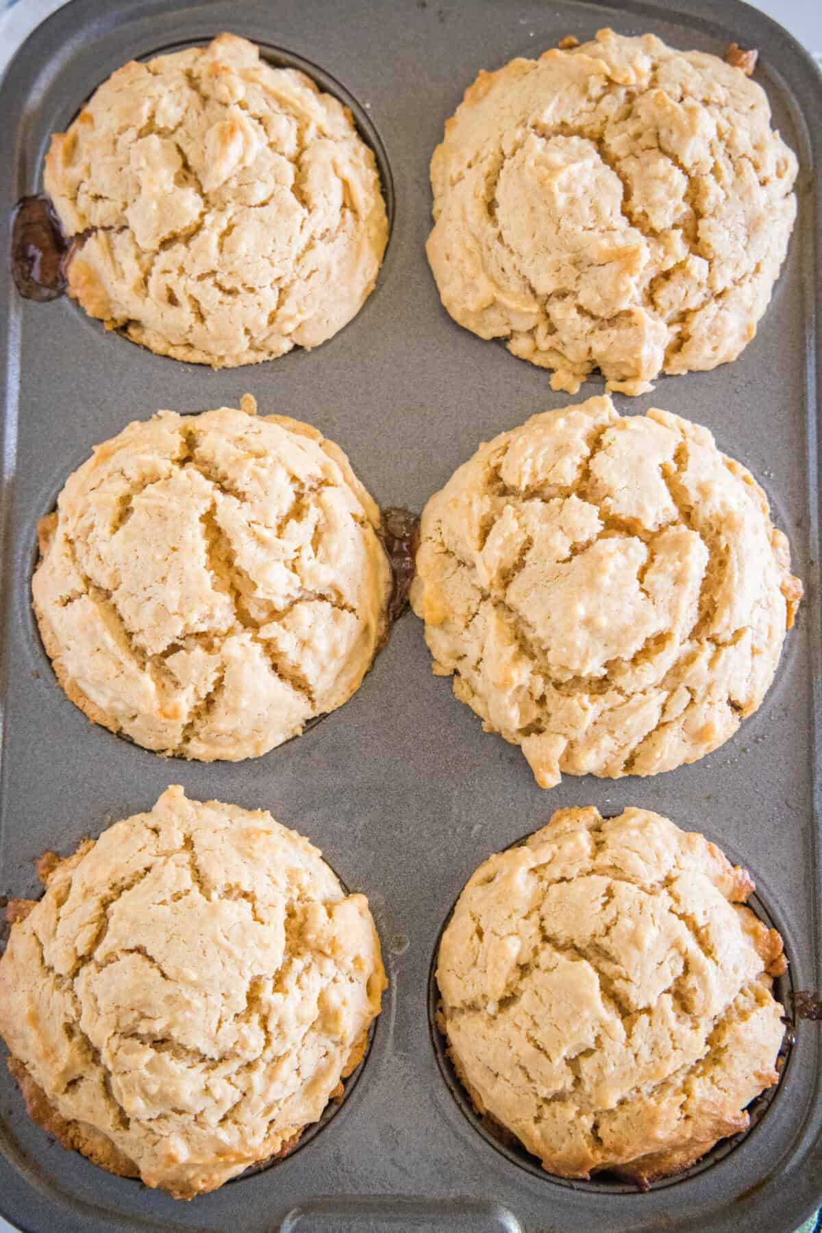 baked peanut butter muffins in a muffin tin