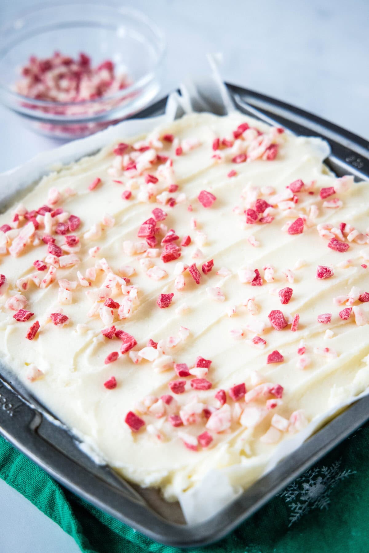 frosted peppermint sugar cookie bars in baking pan