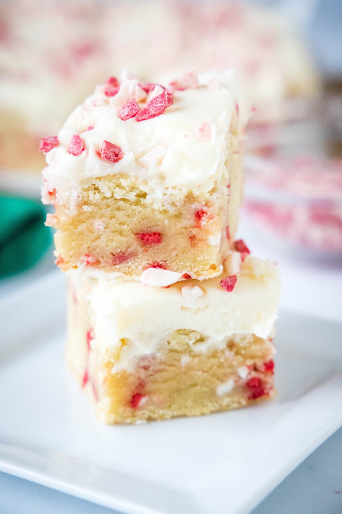 stacked peppermint sugar cookie bars on a plate
