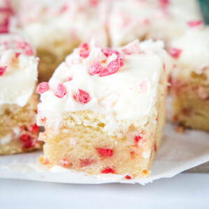 close up peppermint sugar cookie bars sliced on a board