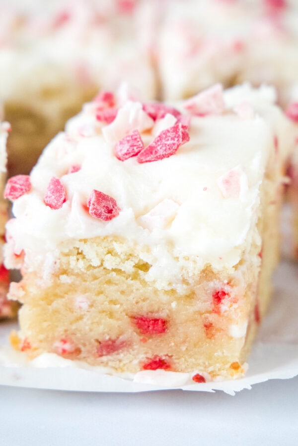 close up peppermint sugar cookie bars sliced on a board