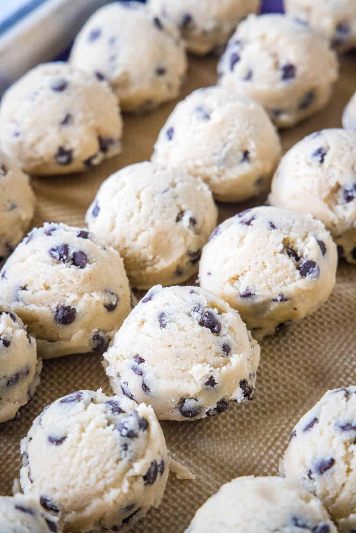 balls of cookie dough on a baking sheet