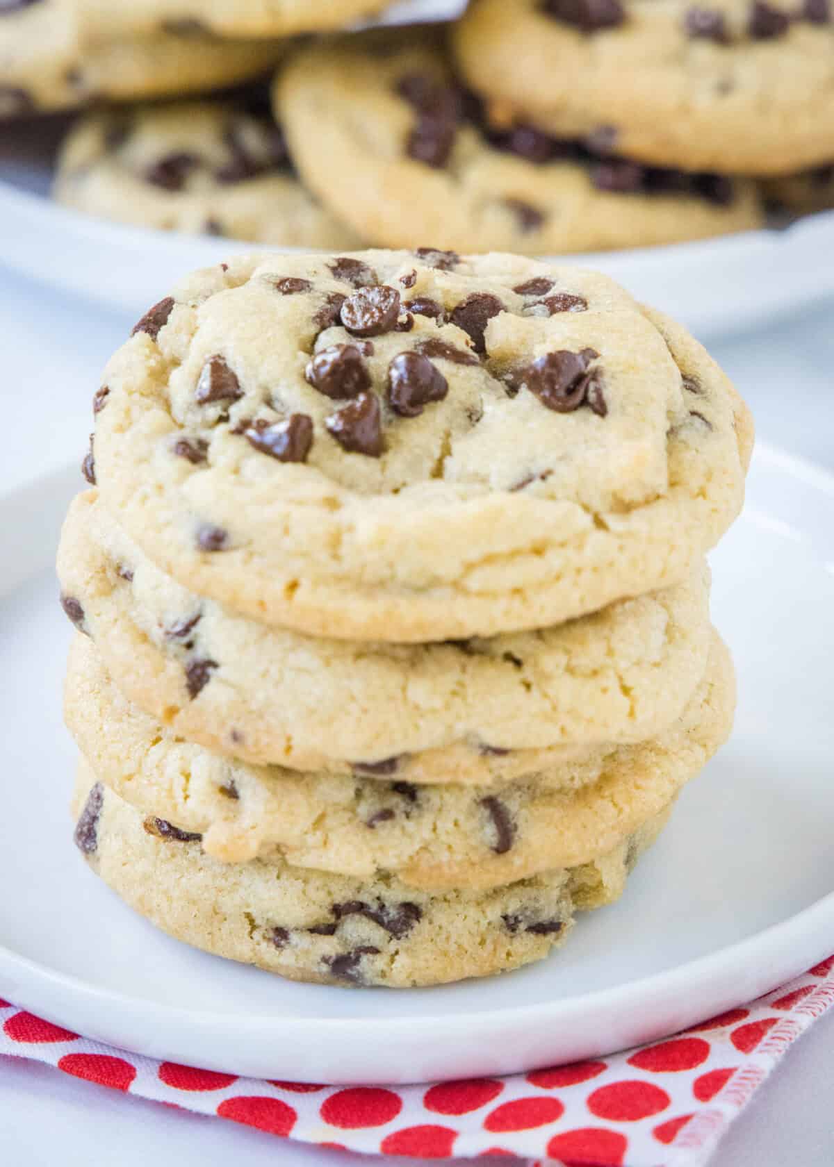 stacked chocolate chip cookies on a plate