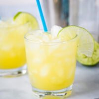 A glass of margarita with slice of lime, with Margarita