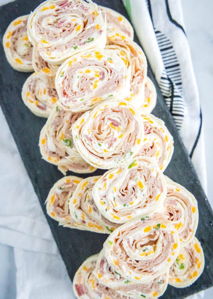 stacked turkey pinwheels on a serving platter
