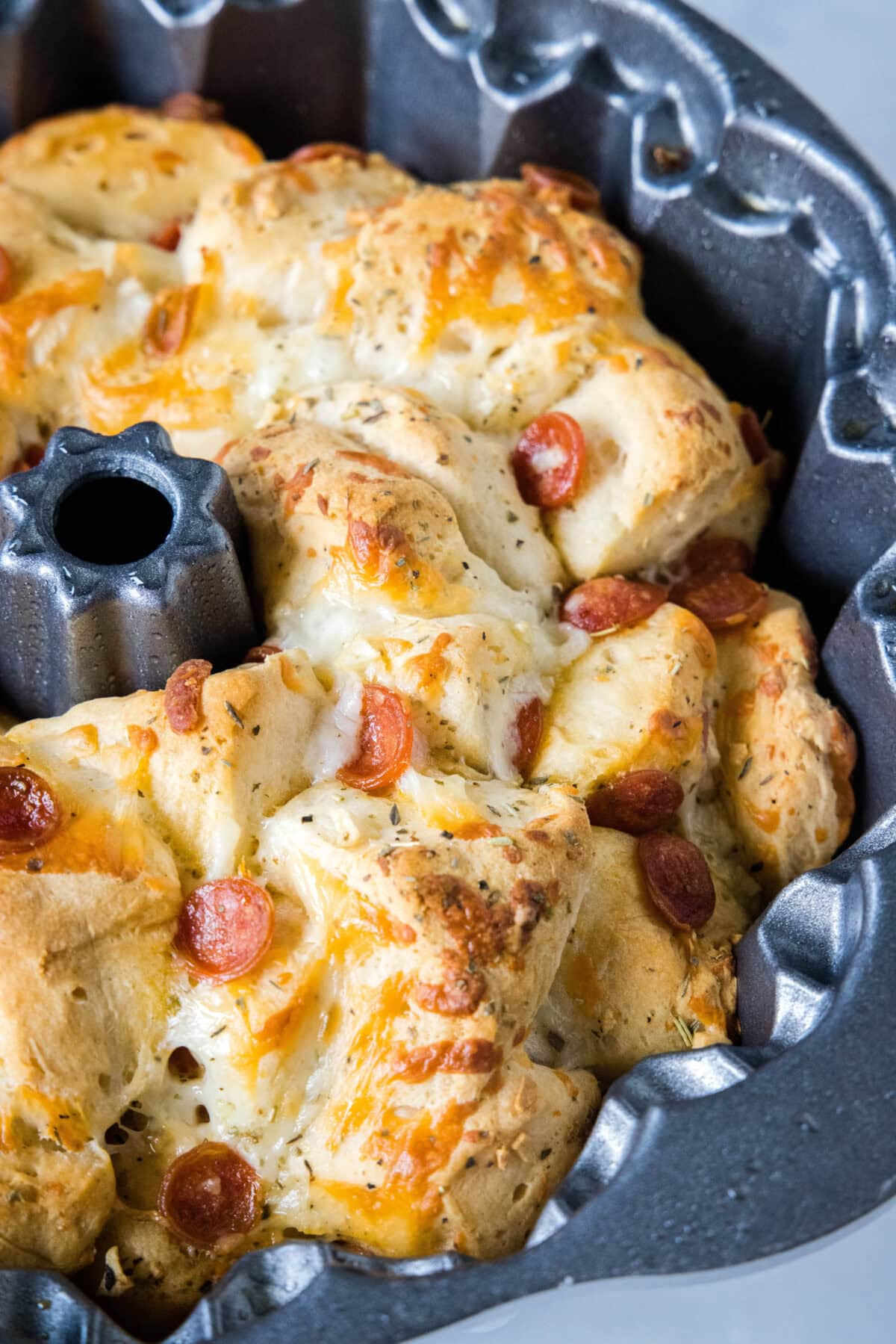 Close up of pizza monkey bread baked in a bundt pan.