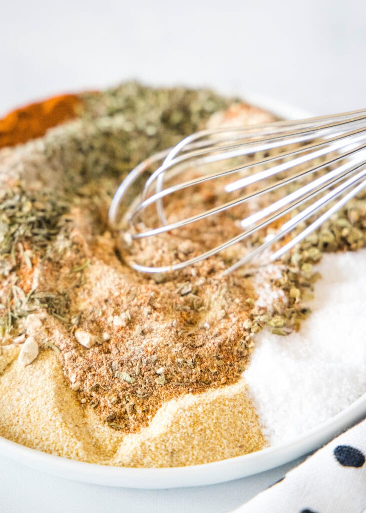 spices being mixed together on a plate