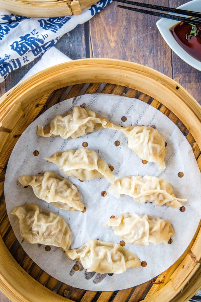 steamed dumplings in a steamer basket