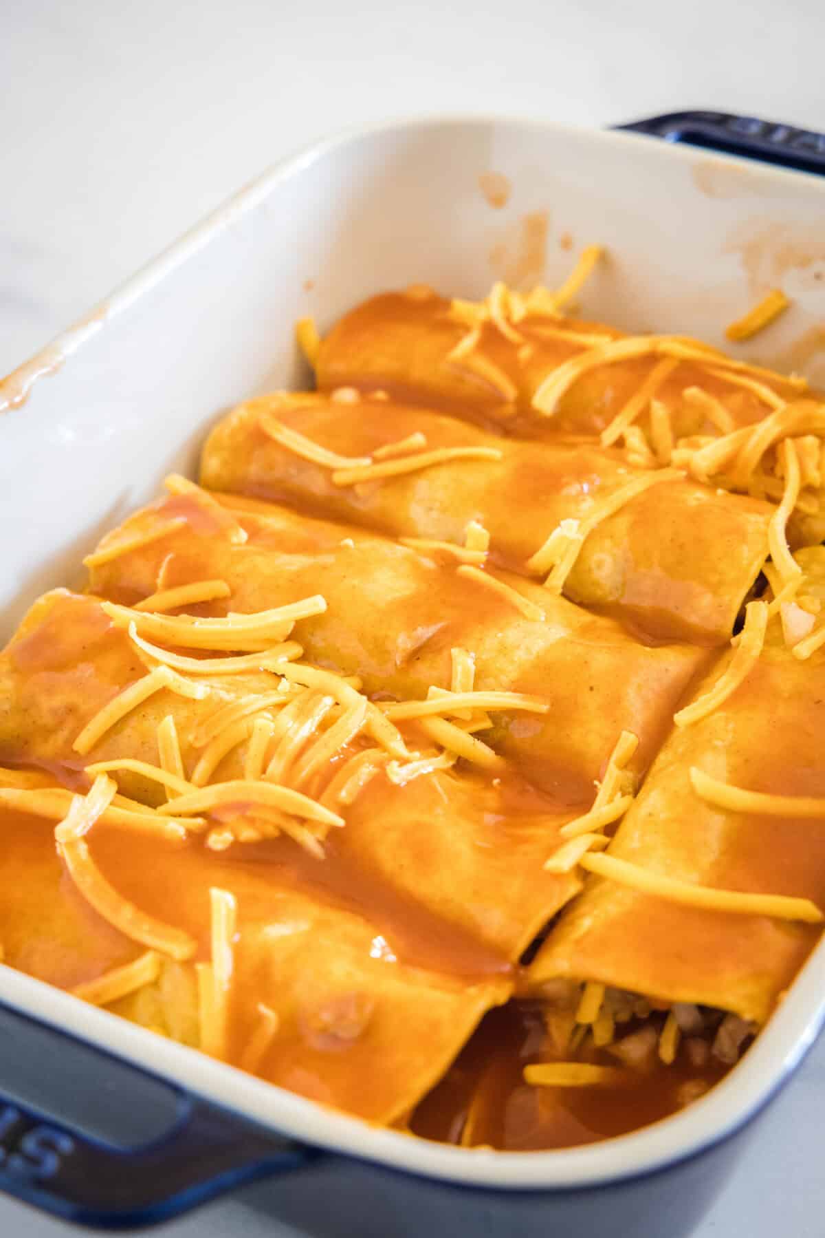 enchiladas in pan ready to go in the oven