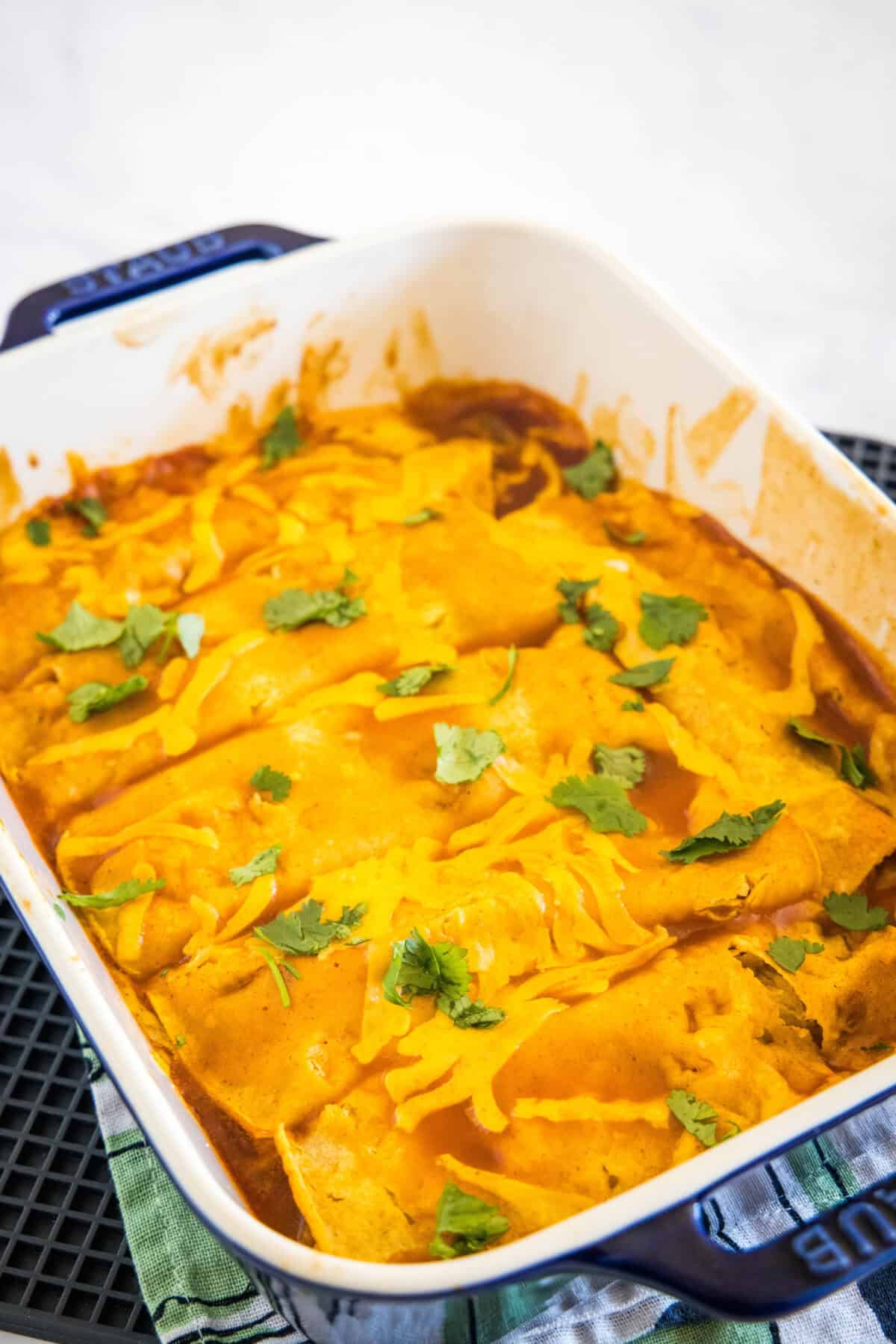 pan with baked enchiladas in it