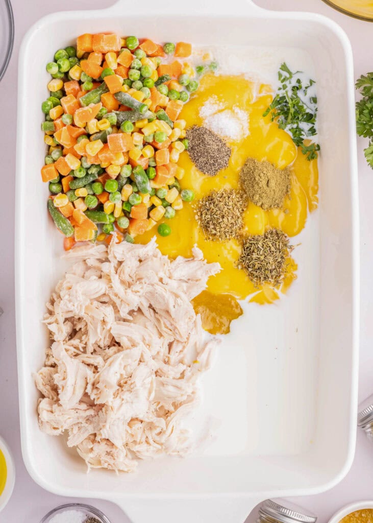 ingredients for chicken pot pie casserole in baking dish