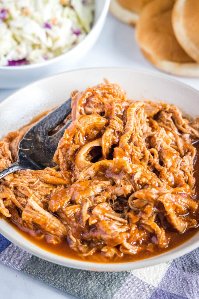 barbecue pulled pork in a white bowl