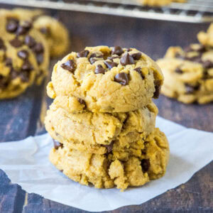 close up stack of pumpkin chocolate chip cookies