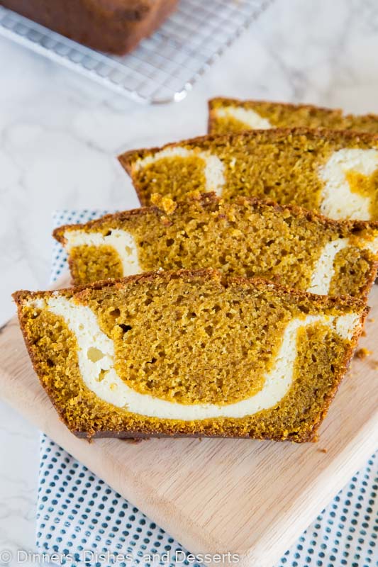 A slice of pumpkin bread with cream cheese swirl