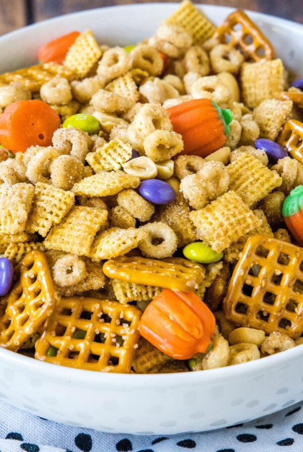 close up serving bowl with pumpkin spice snack mix