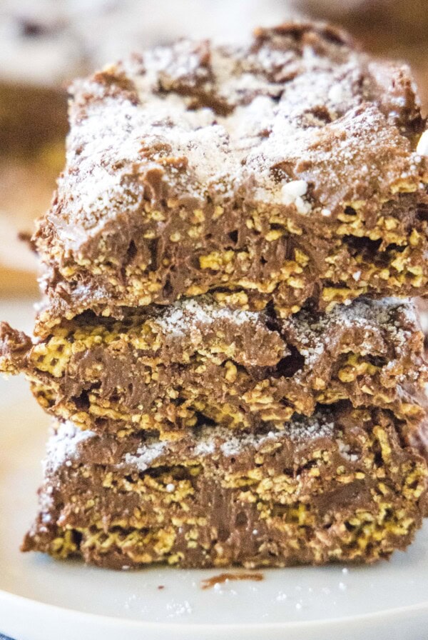 stacked puppy chow bars on a white plate