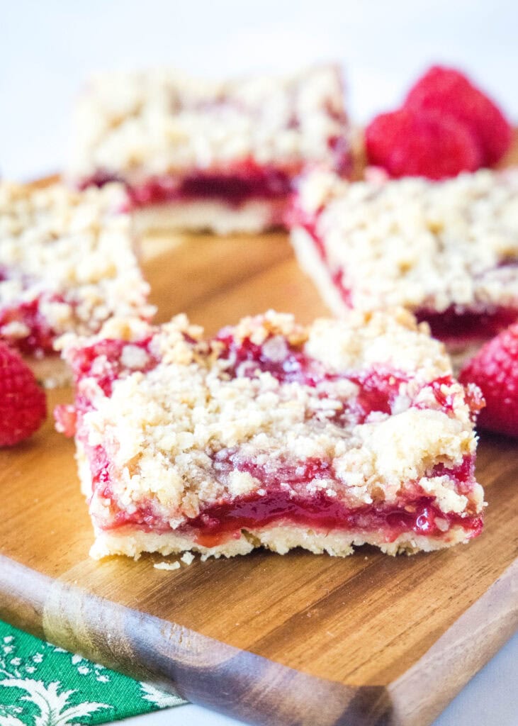 rasbperry crumble bars on cutting board