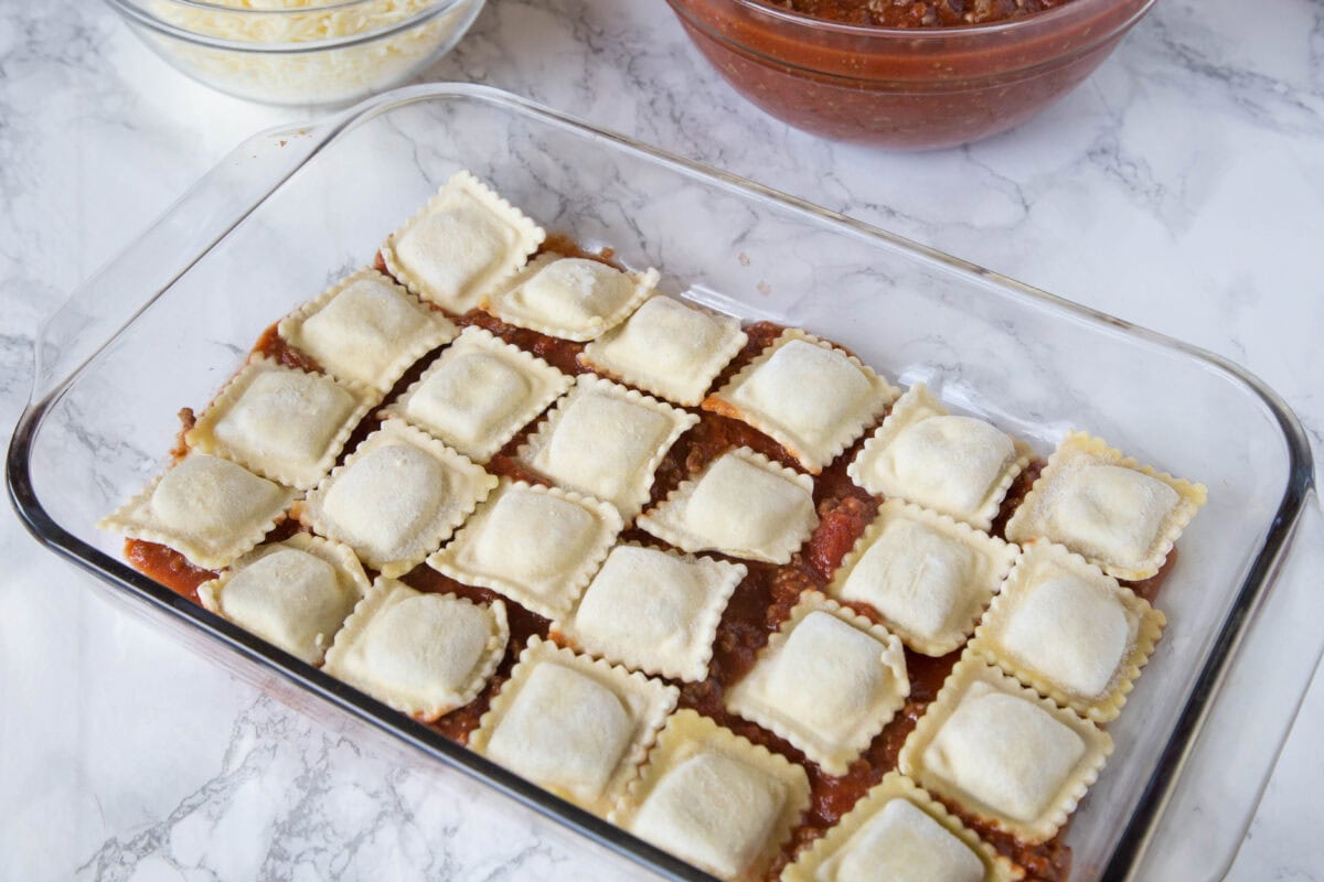 This Baked Ravioli is a quick and comforting dinner made with layers of cheesy ravioli, meaty marinara sauce, and mozzarella. It’s an easy, family-friendly meal everyone will love!