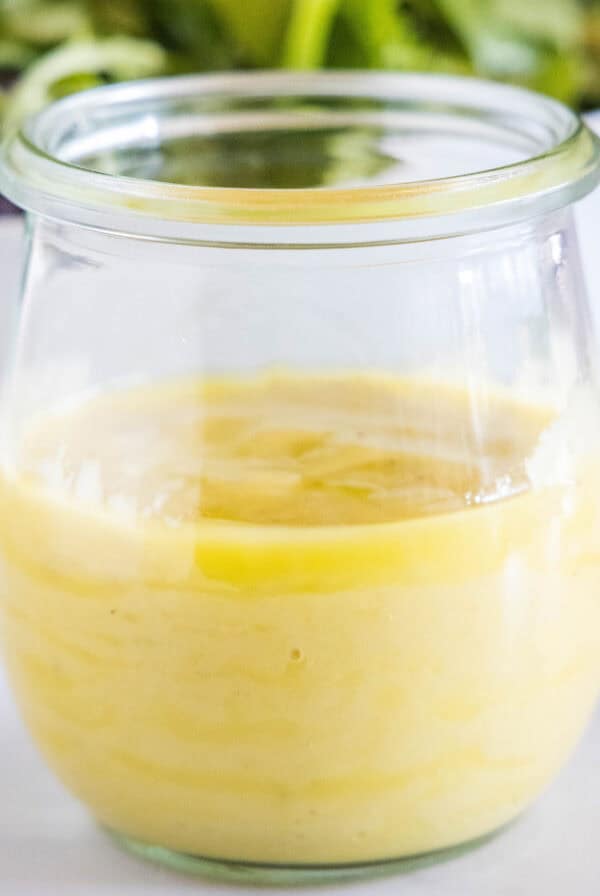 close up roasted garlic vinaigrette in a jar