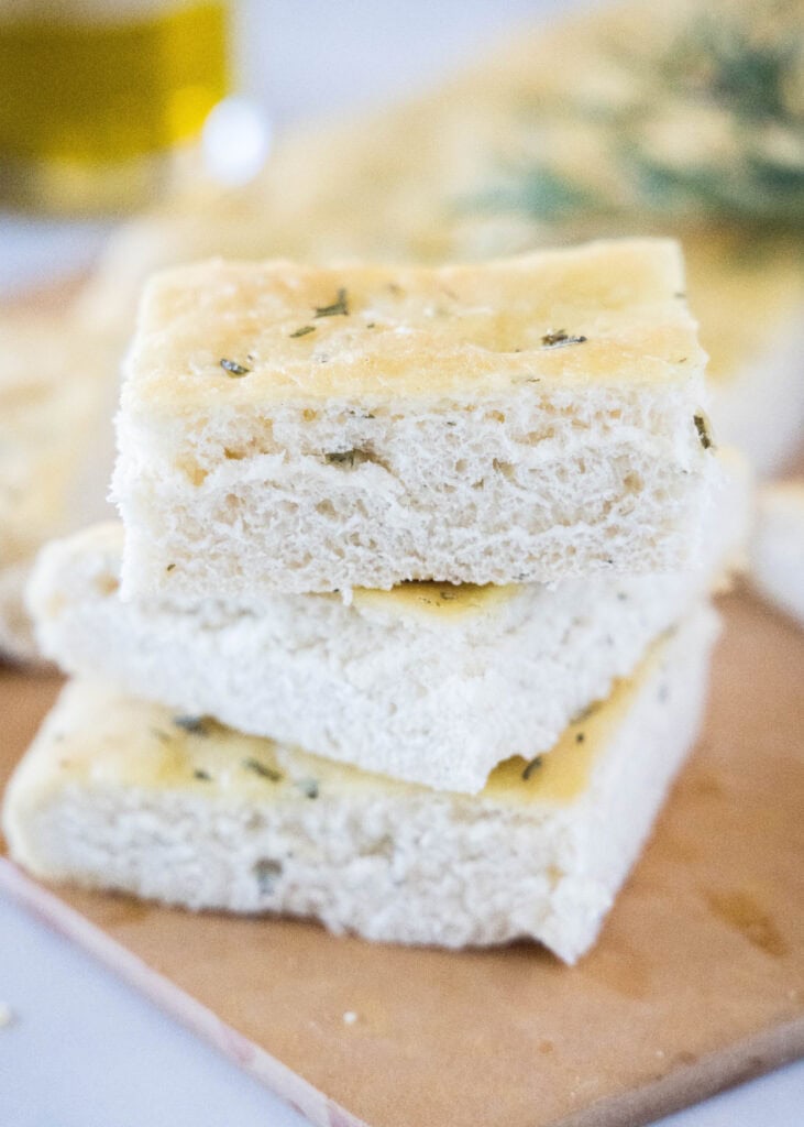 stacked focaccia bread on a cutting board