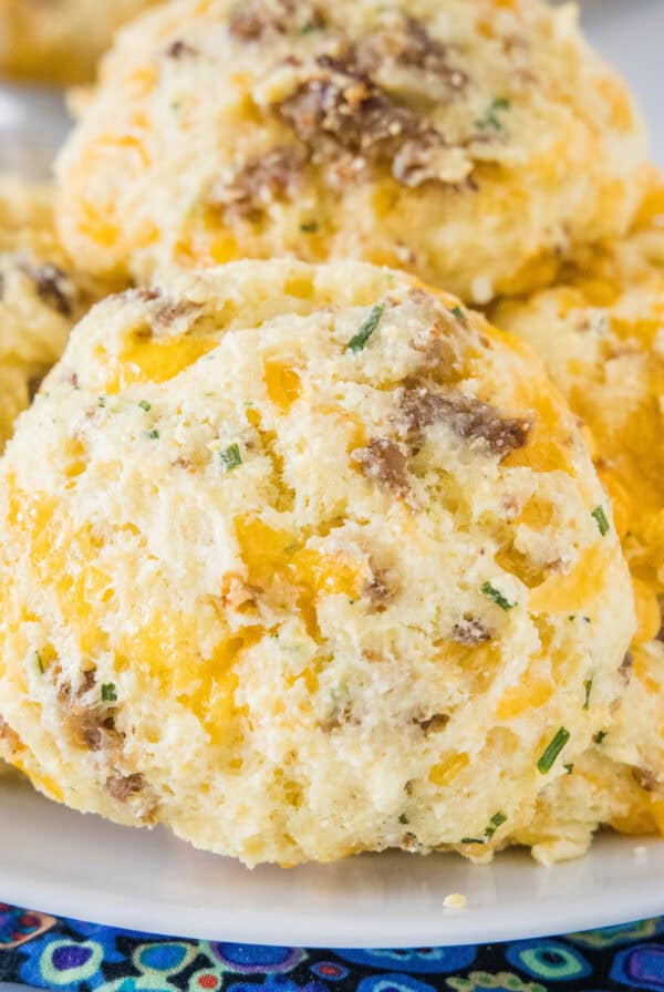 close up cheese & sausage biscuits on a plate