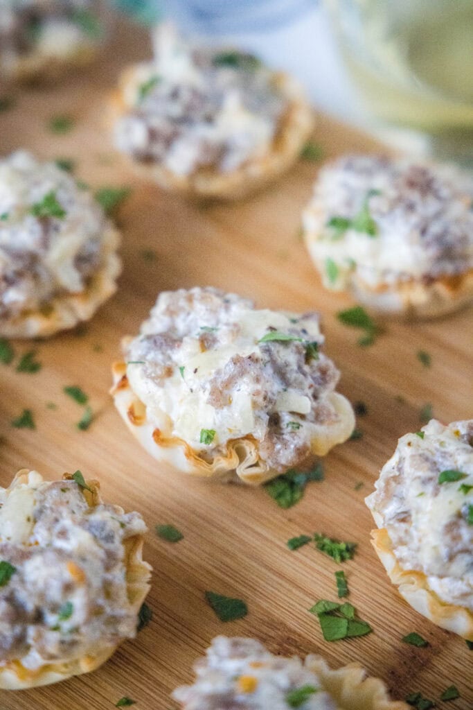 sausage cups arranged on cutting board