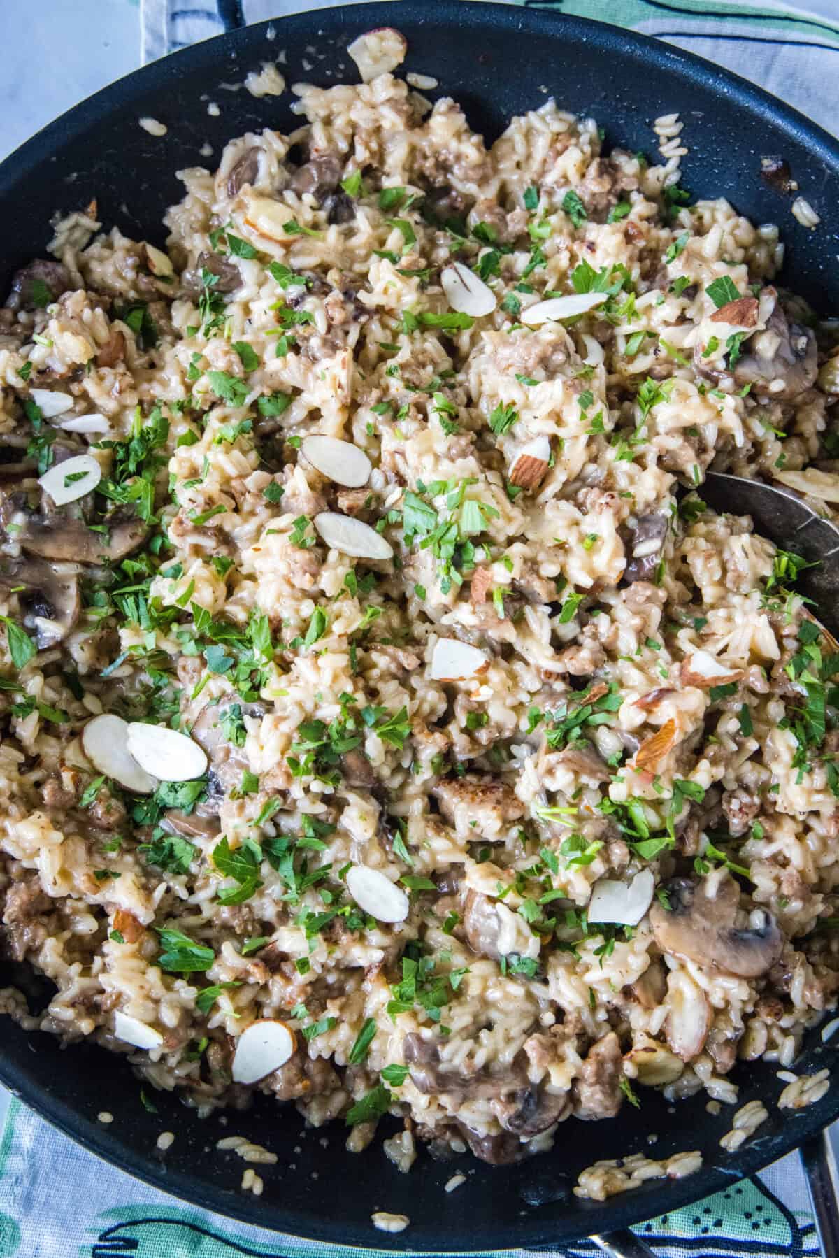 looking down on a skillet with sausage rice casserole