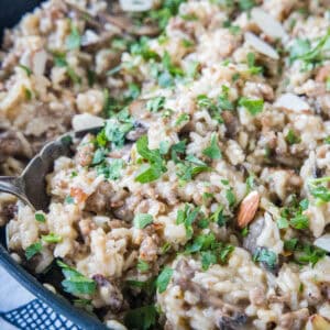 cropped close up sausage and rice in a skillet