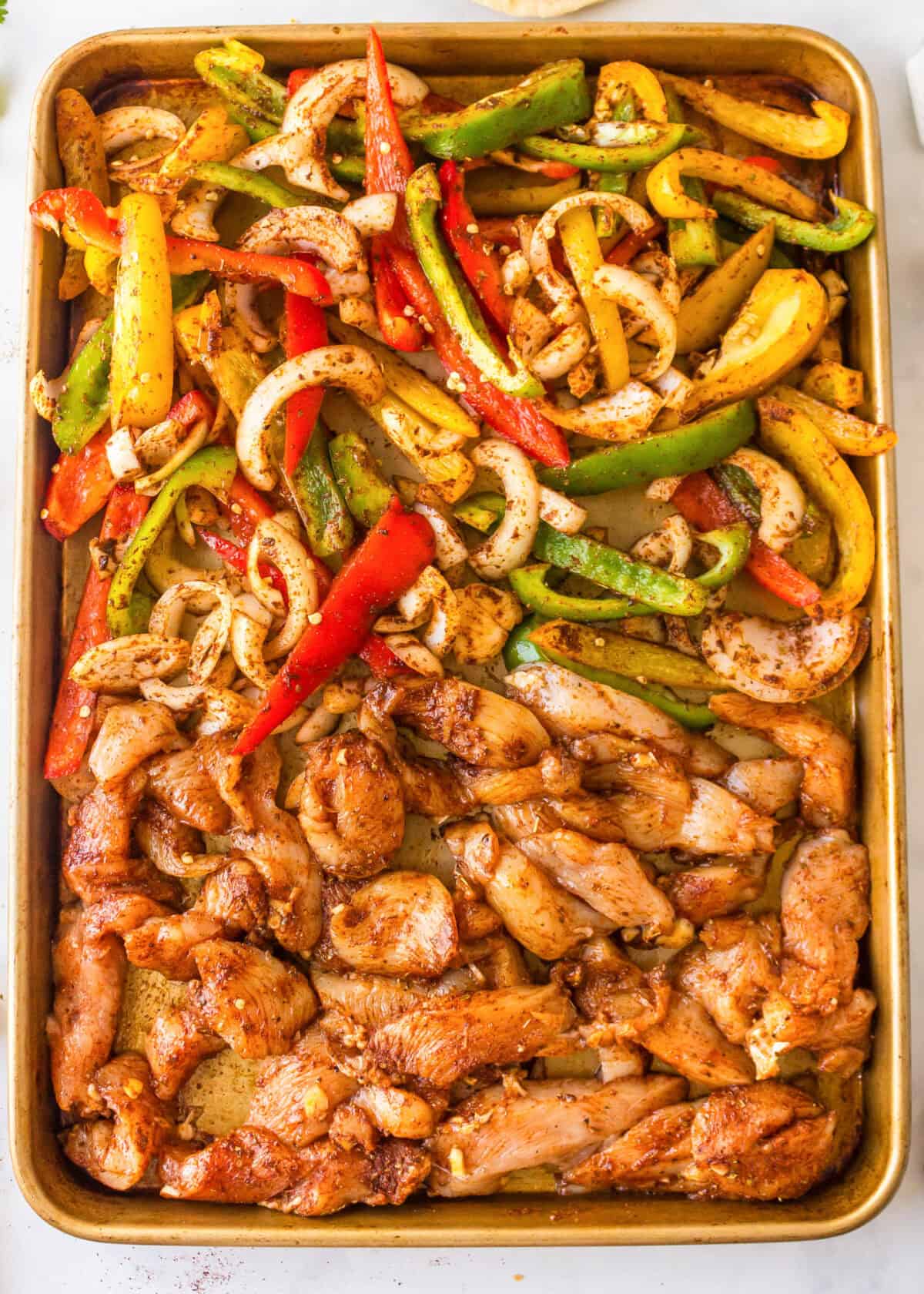 sheet pan chicken fajitas ready for the oven