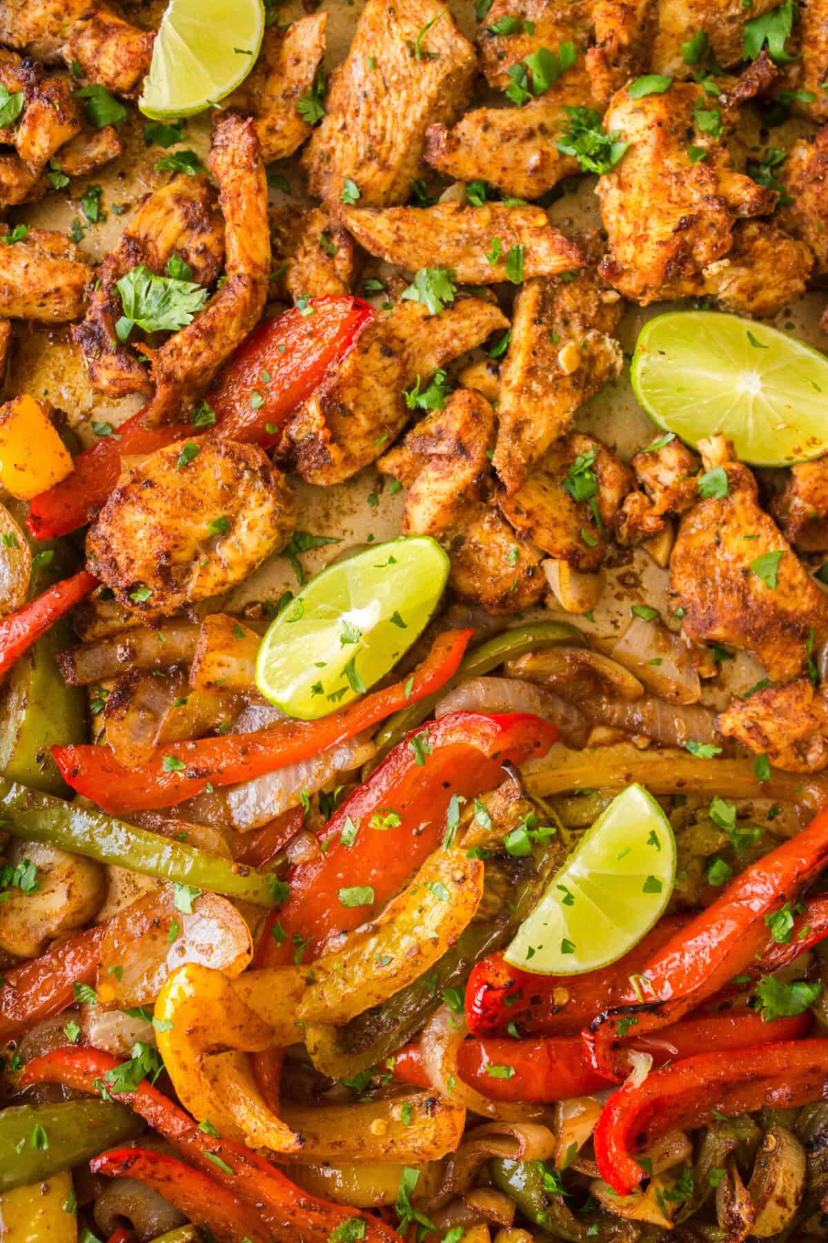 baked sheet pan chicken fajitas on a baking sheet