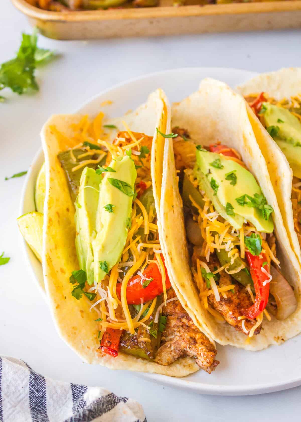 looking down on a plate of assembled chicken fajitas