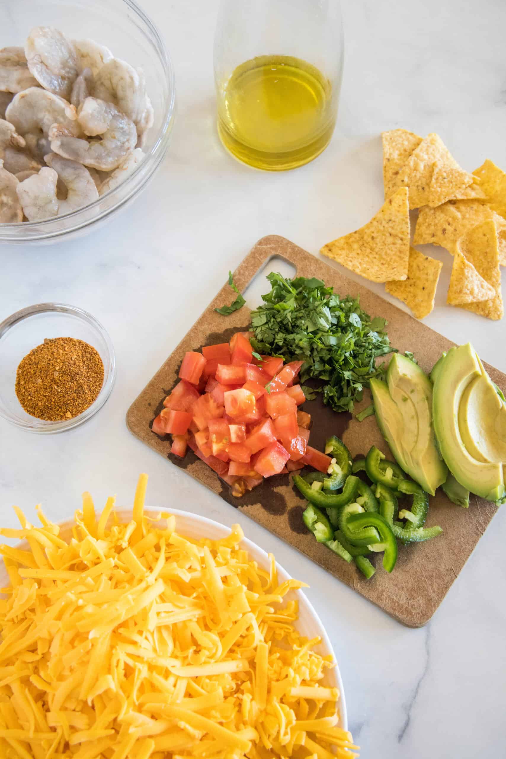 Shrimp nachos ingredients and toppings.