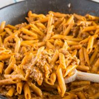 penne pasta with ground beef in a skillet