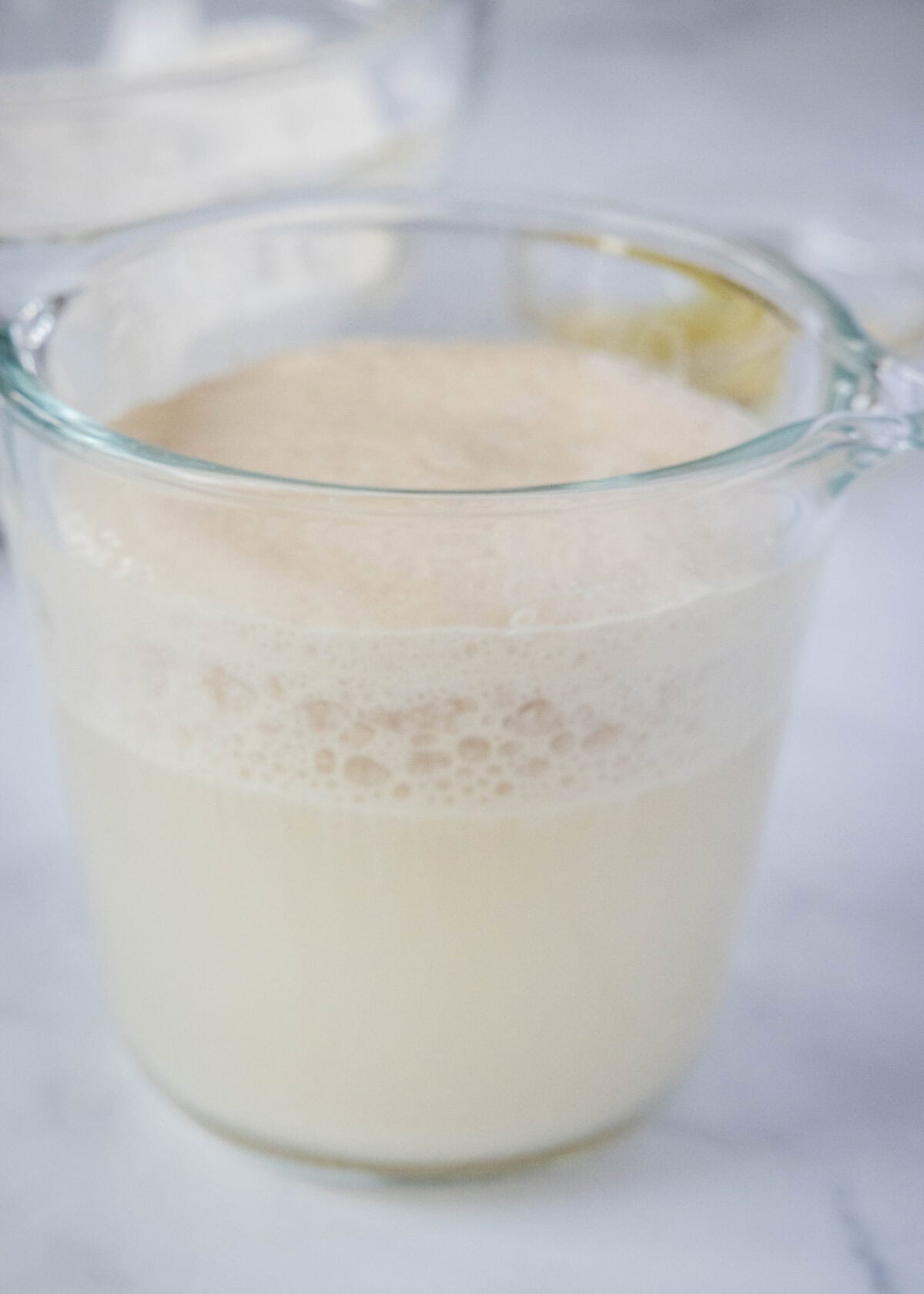 blooming yeast in a measuring cup