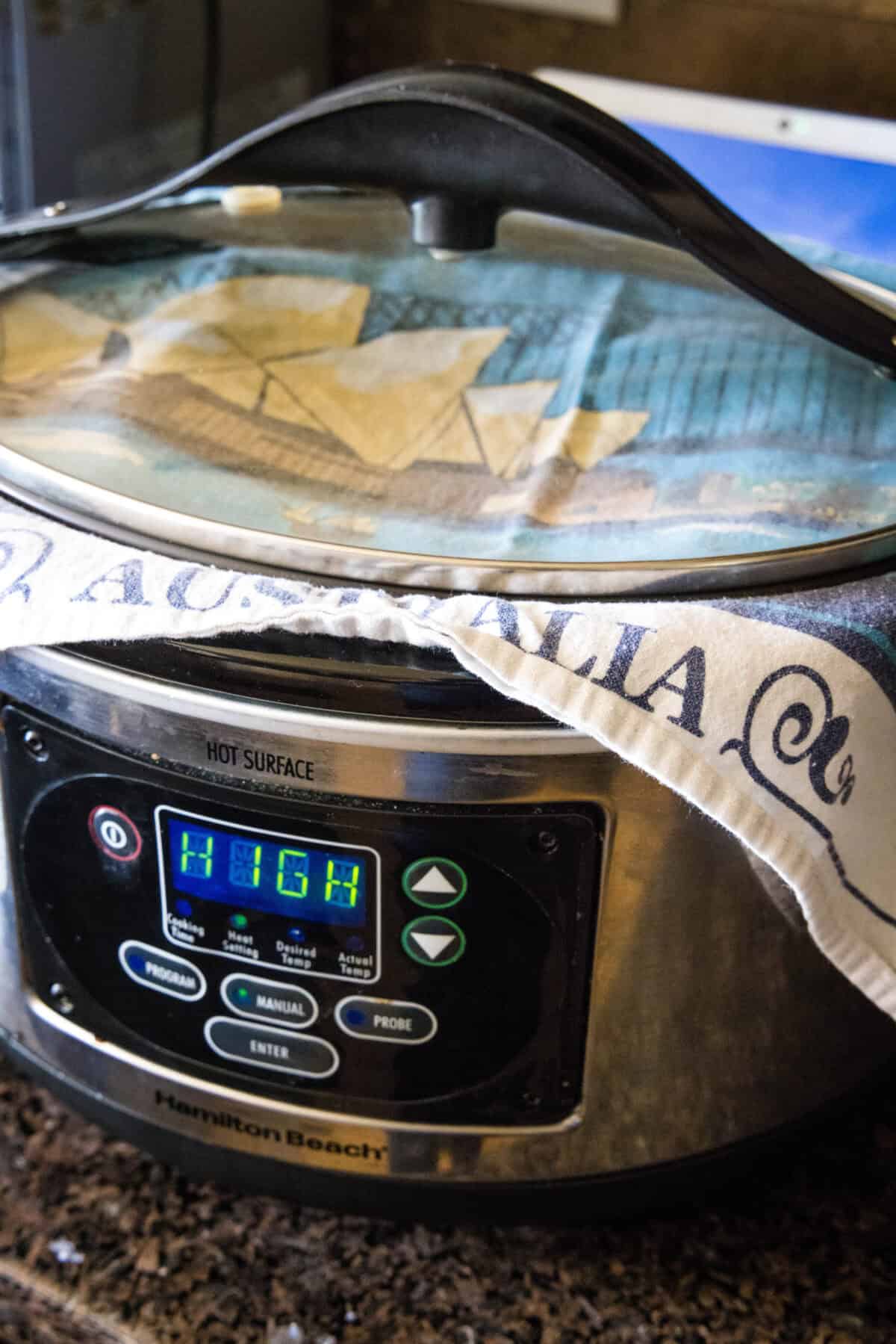 towel over crockpot to make bread