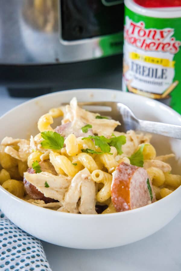 Crockpot Cajun chicken pasta in a bowl with a fork.