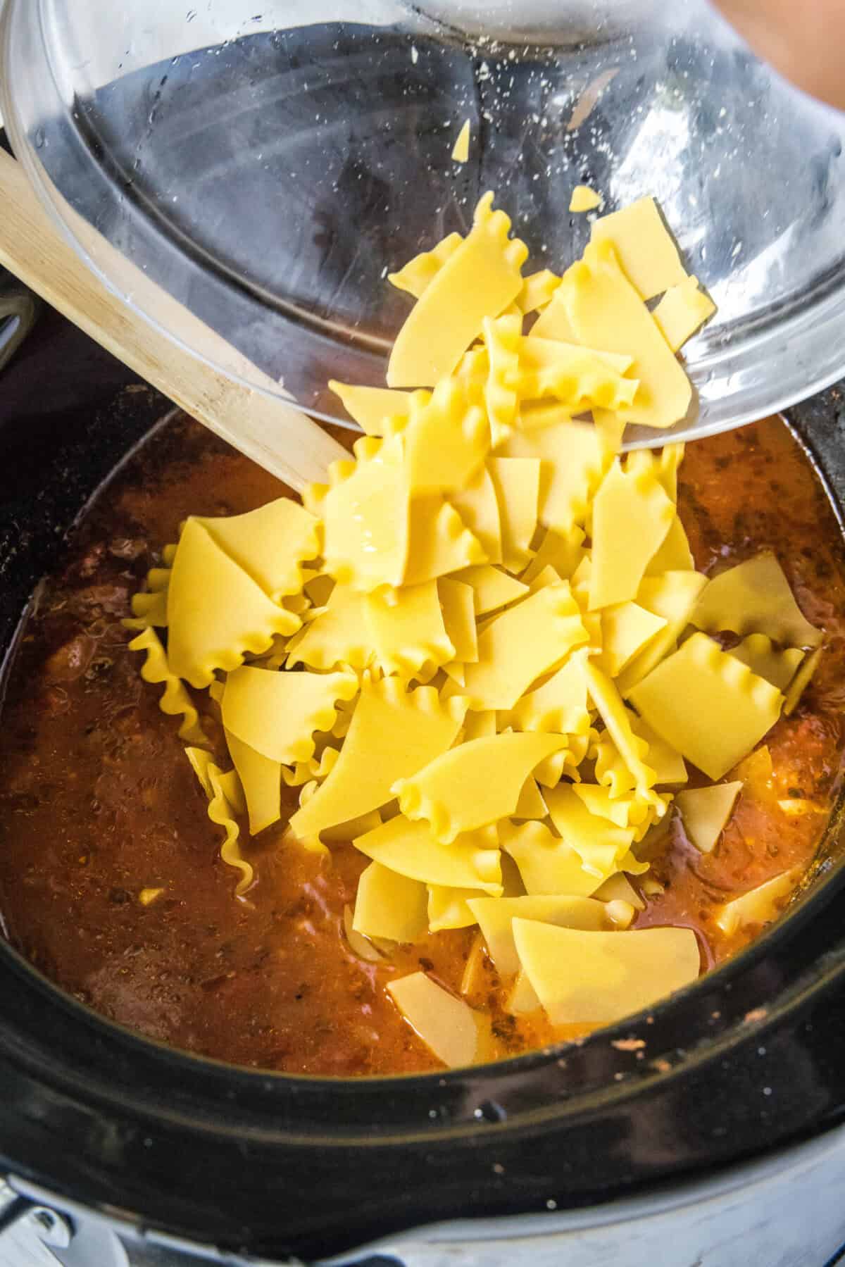This Slow Cooker Lasagna Soup is everything you love about classic lasagna in a warm, comforting bowl. Loaded with ground beef, noodles, rich tomato broth, and melty cheese, it’s an easy dinner the whole family will love!