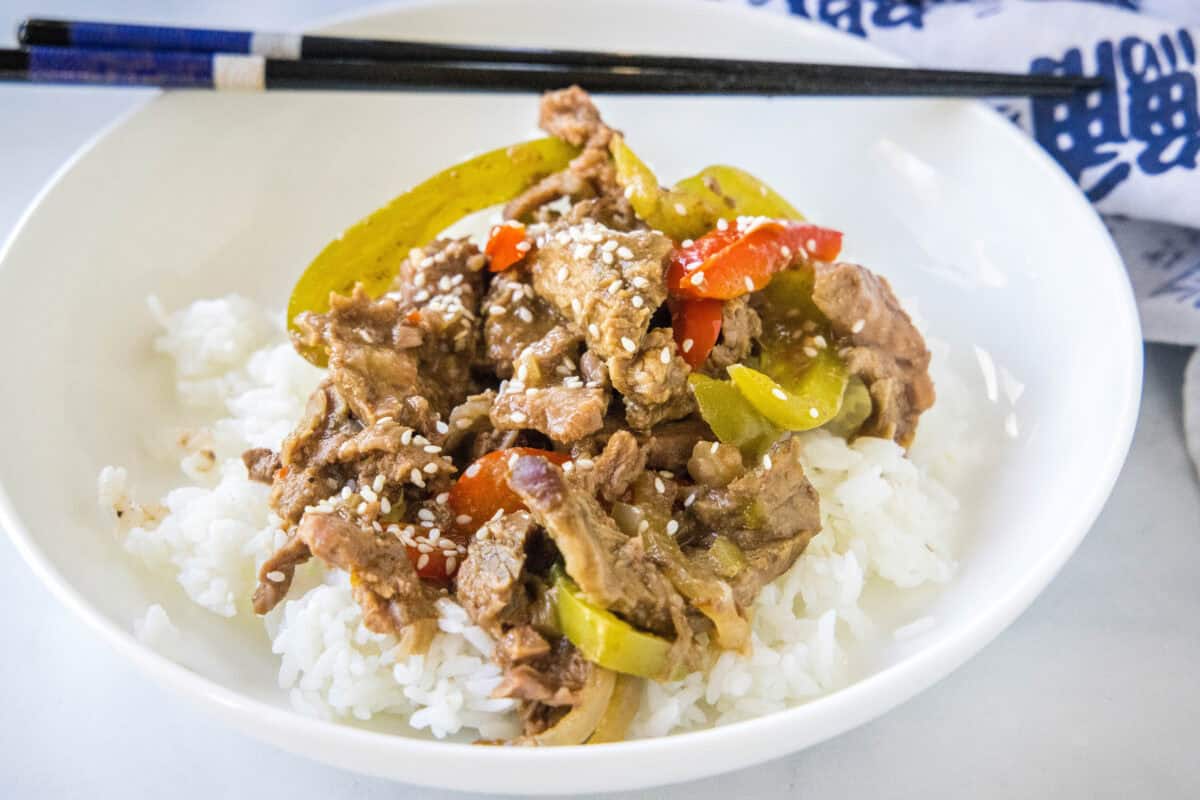 Tender strips of beef, colorful bell peppers, and a savory sauce come together in this easy Slow Cooker Pepper Steak recipe. A super easy dinner that's full of flavor and perfect for busy weeknights!
