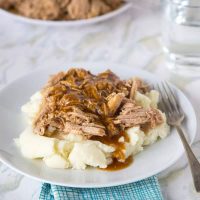 A plate of food on a table, with Cooker and Pork