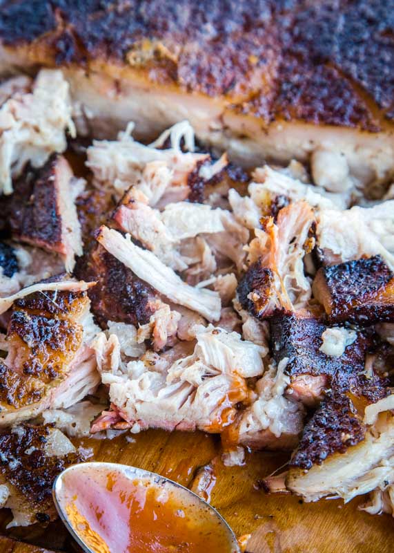 smoked pulled pork on cutting board